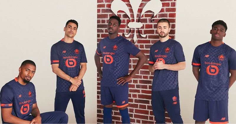 players wearing lille 2023-24 third shirt in purple